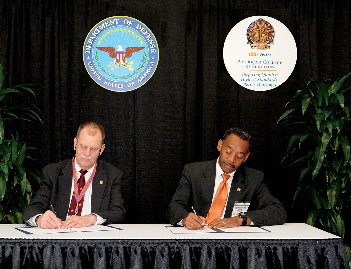 2014 photo of the signing of the Military Health System Strategic Partnership with the ACS